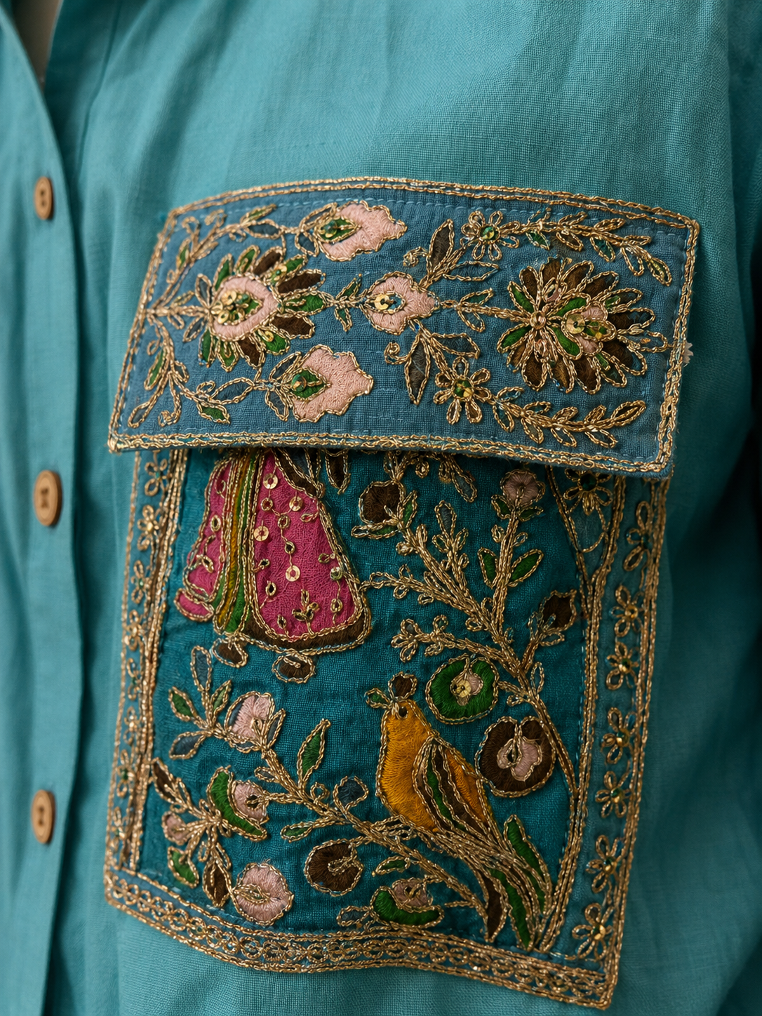 Close-up of embroidery on the Noori turquoise shirt